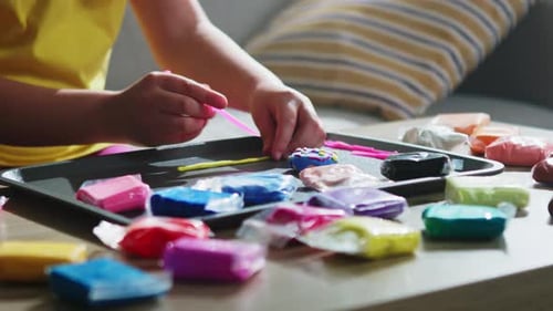 Child Is Sculpting Doughnut From Plasticine