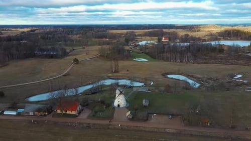 Old Araisi Windmill in Latvia Aerial Shot From Above. Winter Day at Sunrise 4K Video