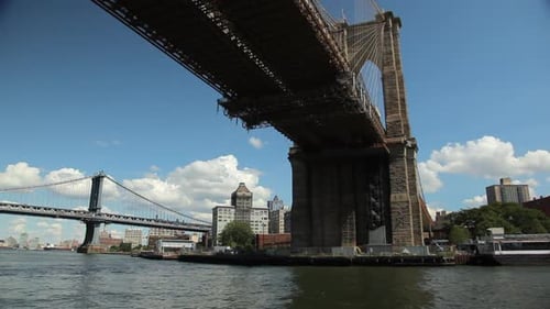 View of the Brooklyn and Manhattan Bridge while floating East River by Ferry.