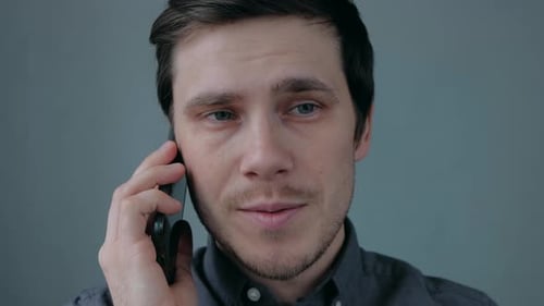 Young Man Talking on Cellphone Close Up