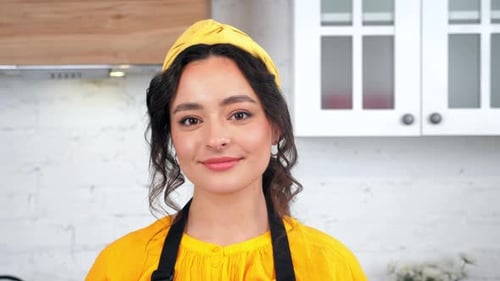 Close Up Smiling Beautiful Housewife Looking at Camera in Home Modern Kitchen