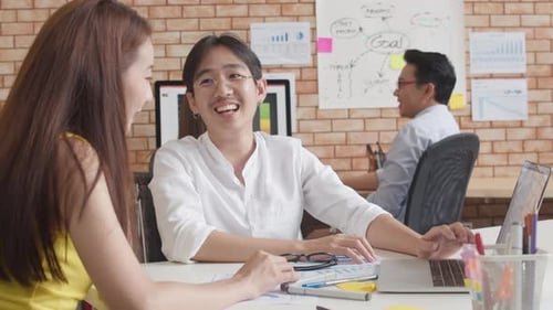 Team Discussing Business Strategy in Modern Office
