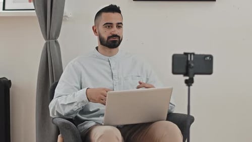 Young Adult Man Recording Video with Phone