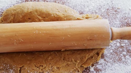 Dough Rolled Out by a Wooden Rolling Pin