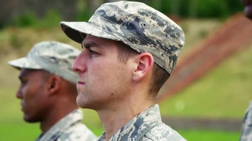 Soldiers in Camouflage Stand at Attention