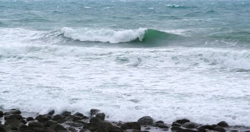 Beautiful sea waves with stone and rock