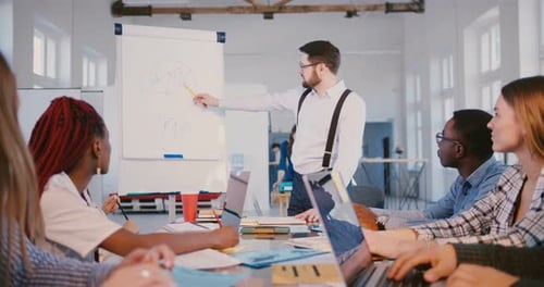 Business Presentation to Coworkers in Modern Office