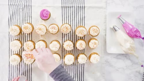 Cupcakes Being Decorated with Colorful Sprinkles, Overhead Shot