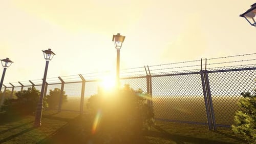 Sunny Scene with Fence, Streetlights and Moving Camera