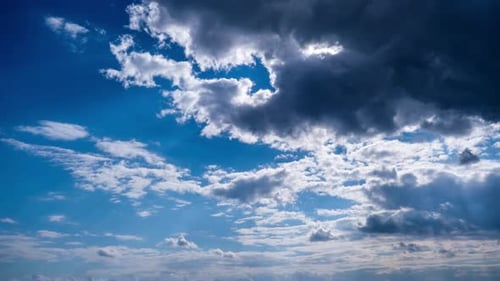 Clouds Billowing in a Bright Blue Sky