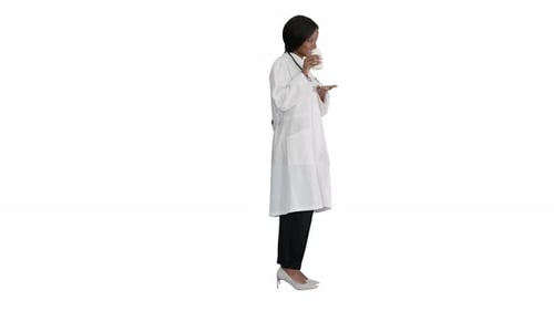 Woman doctor taking medicine pills in white setting