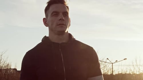 Man in Black Jacket Looking Left Outdoors