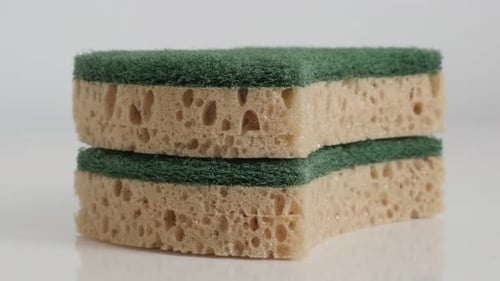 Two Cleaning Sponges Stacked Together Close Up