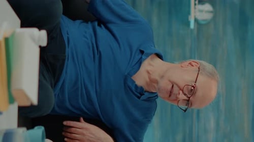 Senior Man Receiving Healthcare in Home Setting