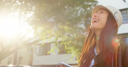 Woman using mobile phone in city street 4k
