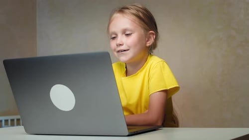 Girl Using Laptop Computer for Video Call at Home