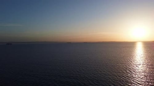 View of the Reflection in the Black Sea Against the Background of the Sky and Sunset