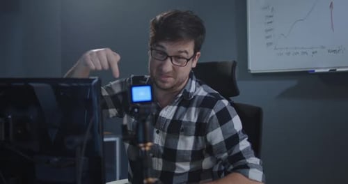Man Recording a Vlog in Office