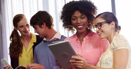 Smiling Adults Using Mobile Devices in an Office