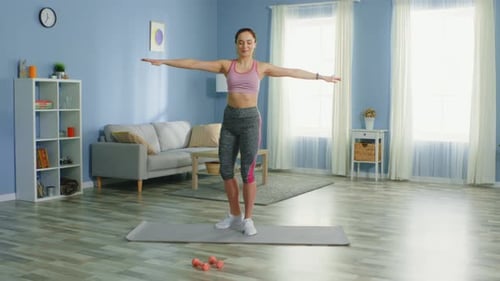 Young Woman Doing Leg Raises at Home