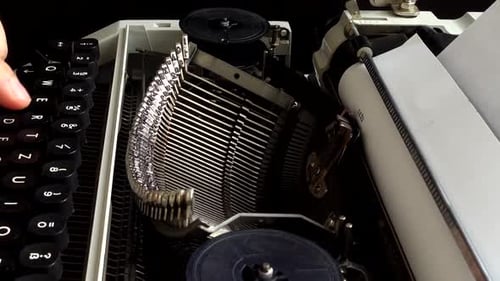 Typing on Classic Typewriter Close Up
