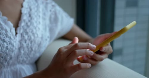 Woman use of mobile phone at home