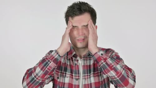 Man Experiencing Headache Rubbing Temples in Pain