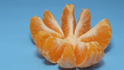 Tangerine Slices Rotate in a Plane