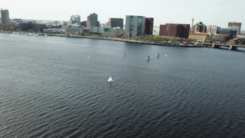 Aerial View Of Sailboats In Charles River With Boston Cityscape From Cambridge, Massachusetts - dron