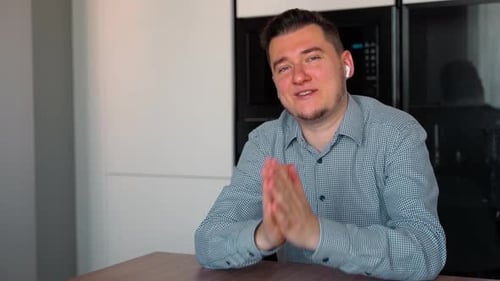 Friendly Man Communicating During Video Call at Home