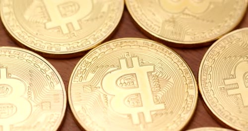 Gold Bitcoin Cryptocurrency Coins Lying Close Together