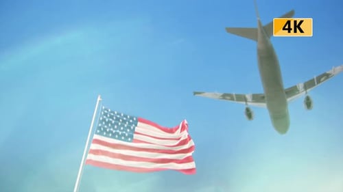 Waving American Flag with Airplane in Blue Sky