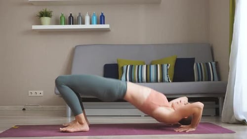 Woman Doing Yoga Exercise at Home