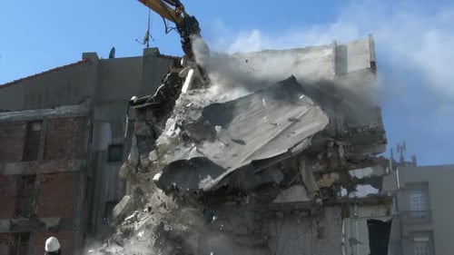 Excavator Demolishing Derelict Building in Urban Setting