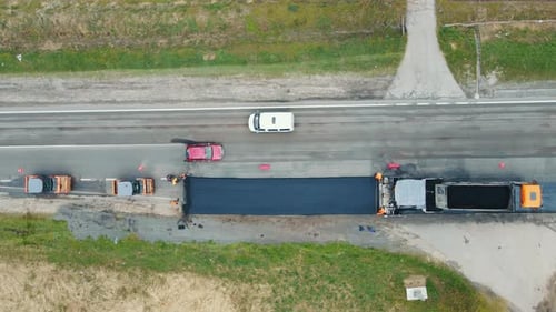 Aerial View Road Service Lays Asphalt on the Road
