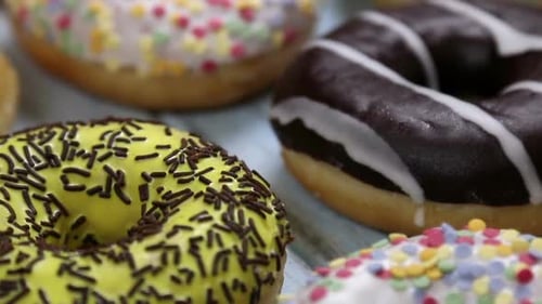 Variety of Colorful Donuts with Frosting and Sprinkles