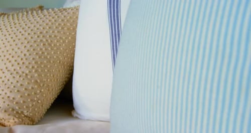 Close-up of cushions on sofa at home 4k