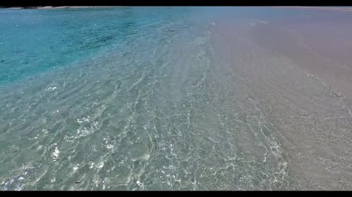 Aerial flying over travel of relaxing resort beach holiday by blue ocean and clean sand background o