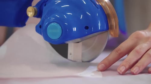 Cutting Fabric with an Automatic Circle Cutter in the Workshop