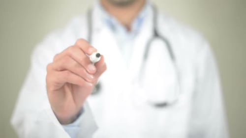 Doctor Writes Word Fitness on Transparent Surface