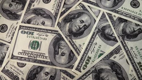 Background with One Hundred Dollar Bills on a Rotating Platform
