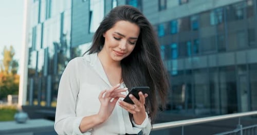 Attractive Girl Working in Office Corporation Company Dressed in Elegant Outfit Stands Leaning