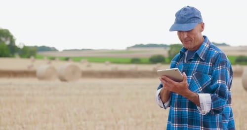 Farmer Using Digital Tablet on Field Agriculture
