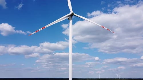 Aerial View of Wind Turbine on Blue Sky