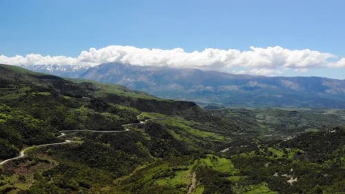 Aerial View of Winding Road in Green Hills