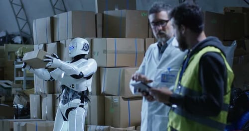 Robot Bringing Box To Technicians in a Warehouse