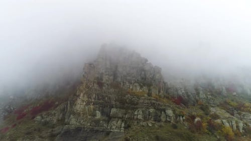 Aerial View On Rocky Mountains In The Fog
