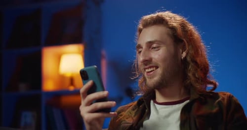 Close Up View of Young Cheerful Guy Talking and Smiling While Having Video Conversation, Handsome