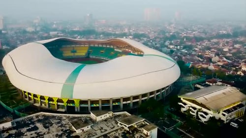 Aerial View - The largest stadium looks from drone. With smog pollution