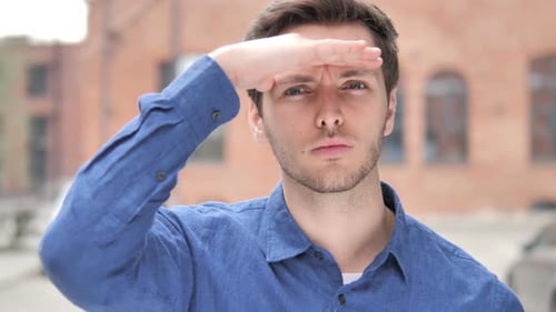 Man Shields Eyes then Smiles